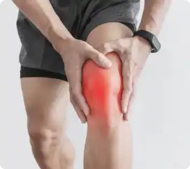Person holding their knee indicating pain.