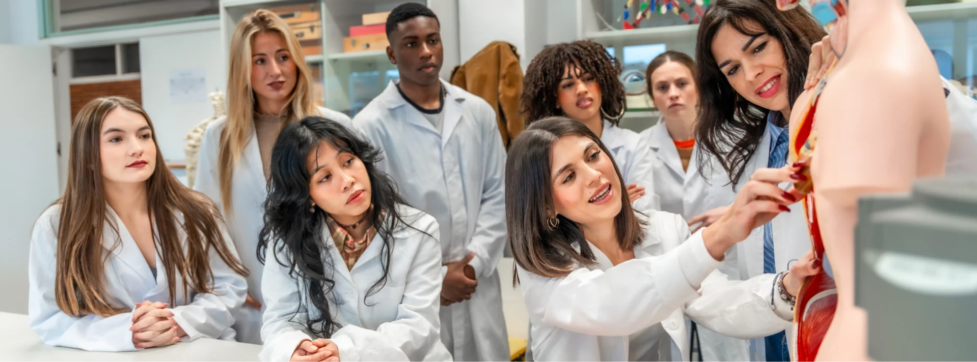 Medical students learning anatomy during a hands-on training session.