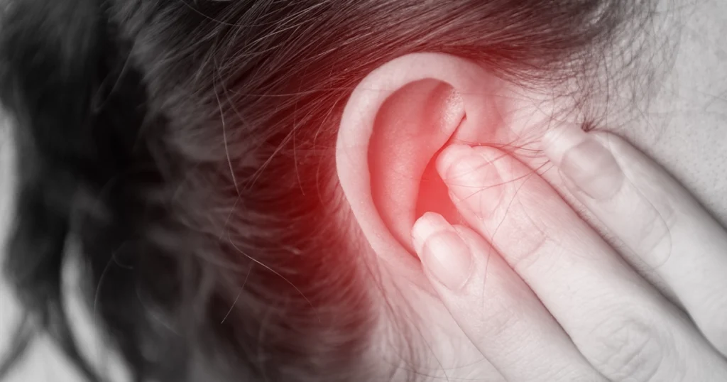 Ear pain and redness from possible ear infection.