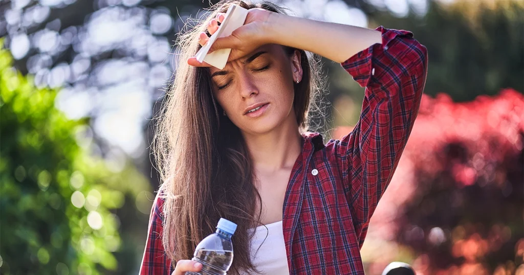Woman suffering dehydration during hot weather.
