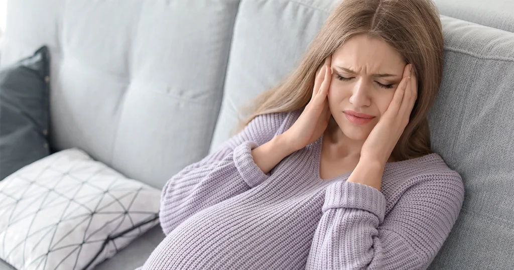 Person experiencing flu symptoms including congestion and fatigue.