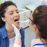 A woman is undergoing check-up with a doctor at Exceptional Emergency Centers.