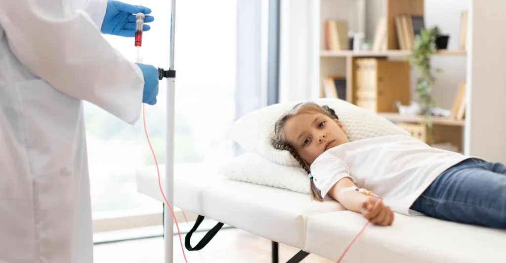 A doctor gently holds a child in a hospital bed, providing comfort and care during a medical examination.