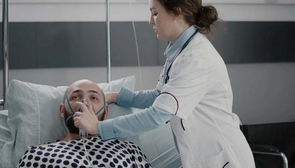 Nurse placing an oxygen mask on a patient in hospital.